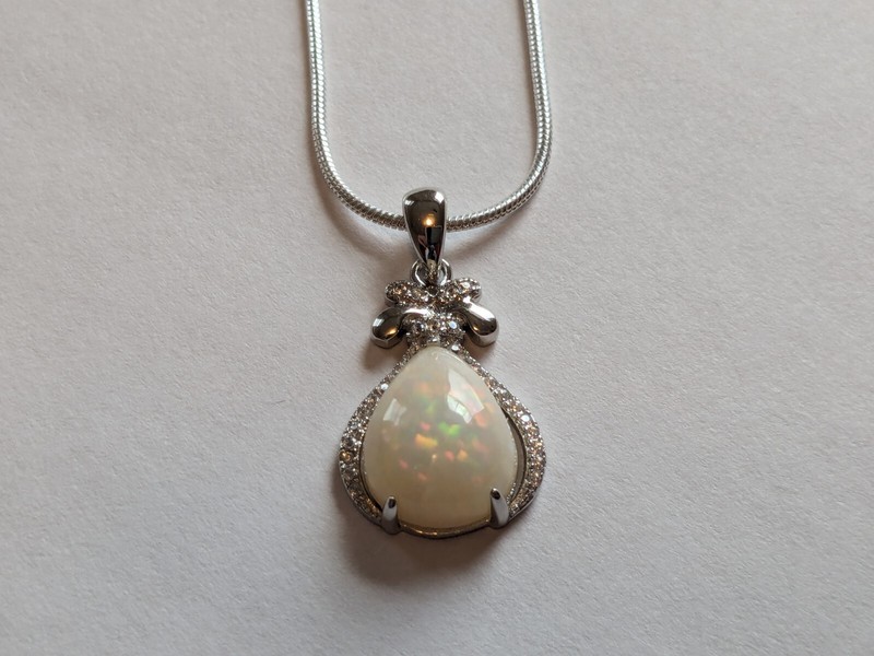 3.42 Ct Ethiopia Natural White Play-of-Color Crystal Pear Opal Silver Pendant