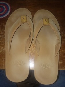 tan nike flip flops