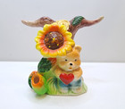 Porcelain napkin holder with a bear and a heart under a sunflower. Table decorat