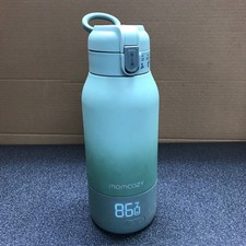 Momcozy Portable Water and Milk Warmer Green Powers On