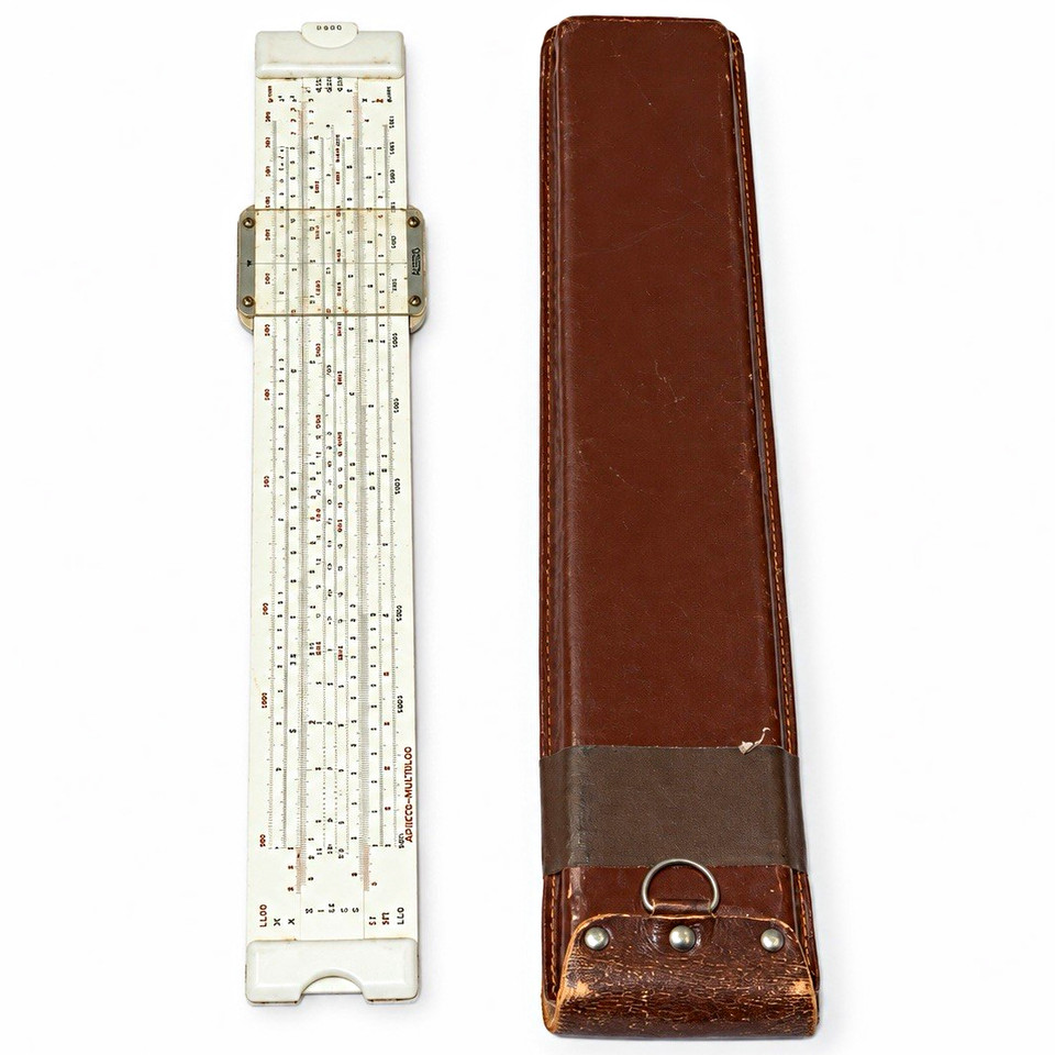 A clean German-made Aristo MultiLog slide rule with its original leather case — a beautifully precise pre-digital computing instrument that engineers once staked careers on.