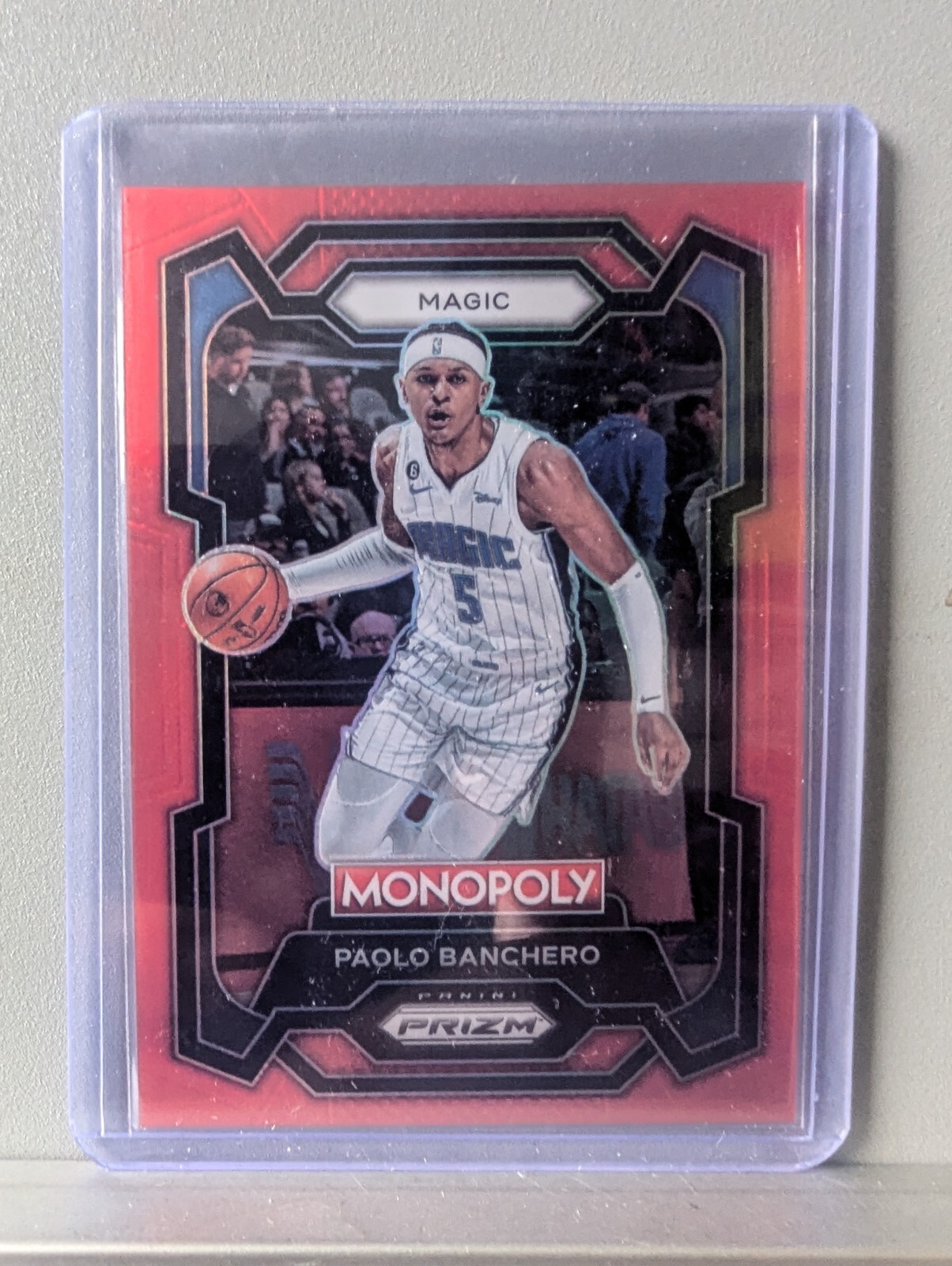 2023-24 Monopoly Prizm Red Prizm 61/99 #64 Paolo Banchero Orlando Magic