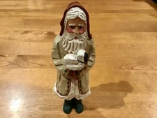 HOUSE OF HATTEN 2000 RAWSON SANTA DRESSED IN TAN HOLDING LAMB  7.5” TALL