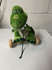 Disney Store Toy Story plush T Rex dinosaur plastic wheels pull toy 9"