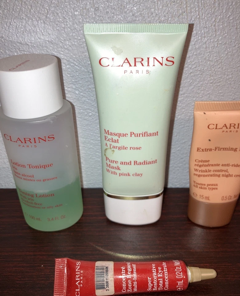 Lote Loción Tonificadora Clarins con Iris, Mascarilla con Arcilla Rosa, Crema de Noche, Suero para Ojos Foto 2 de 4