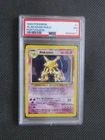 1999 POKEMON GAME BASE SET - PORTUGUESE - ALAKAZAM HOLO - 1 - PSA7 NEAR MINT