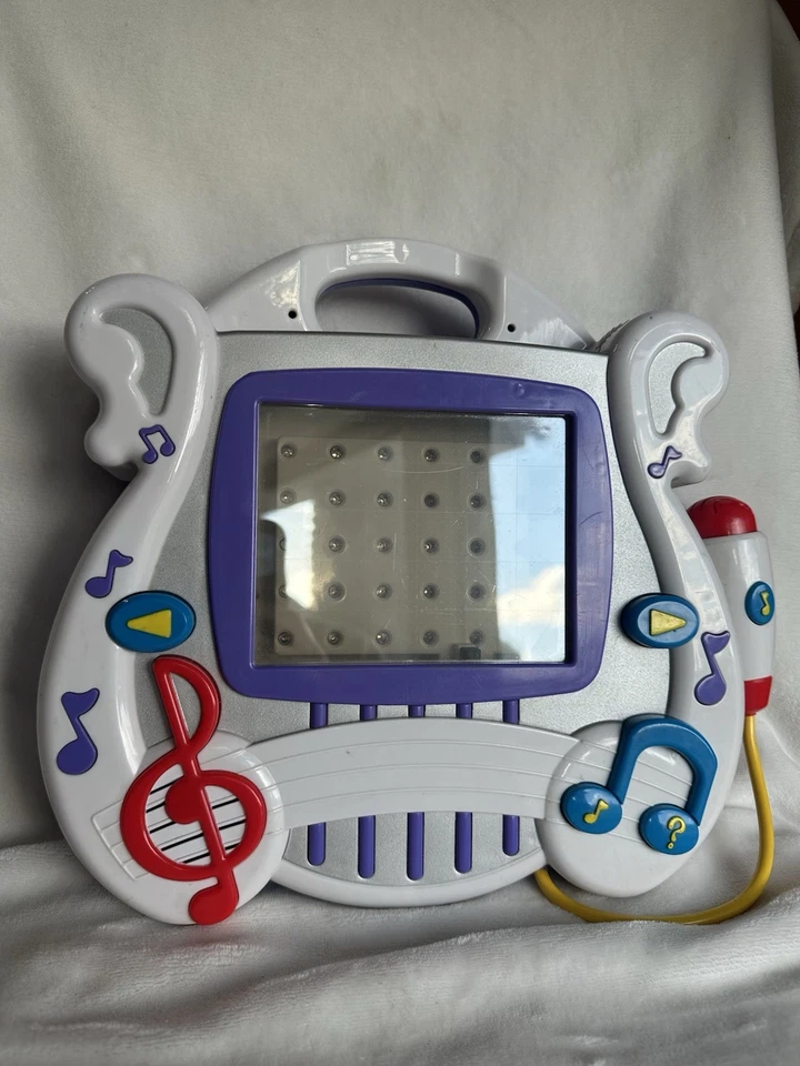 Sistema de aprendizaje interactivo Mattel Learn Through Music 2002 con 4 cartuchos Foto 2 de 4