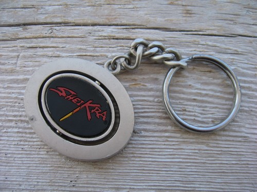 Vintage Busch Gardens SheiKra Souvenir Spinner Keychain Roller Coaster Florida - Picture 1 of 5