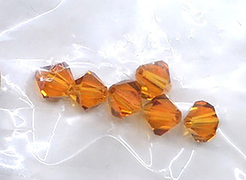 SWAROVSKI BICONE TOPACIO GENUINO CRISTALES AUSTRIACOS 6 PIEZAS CUENTAS 6MM 24269-11 - Imagen 4 de 5