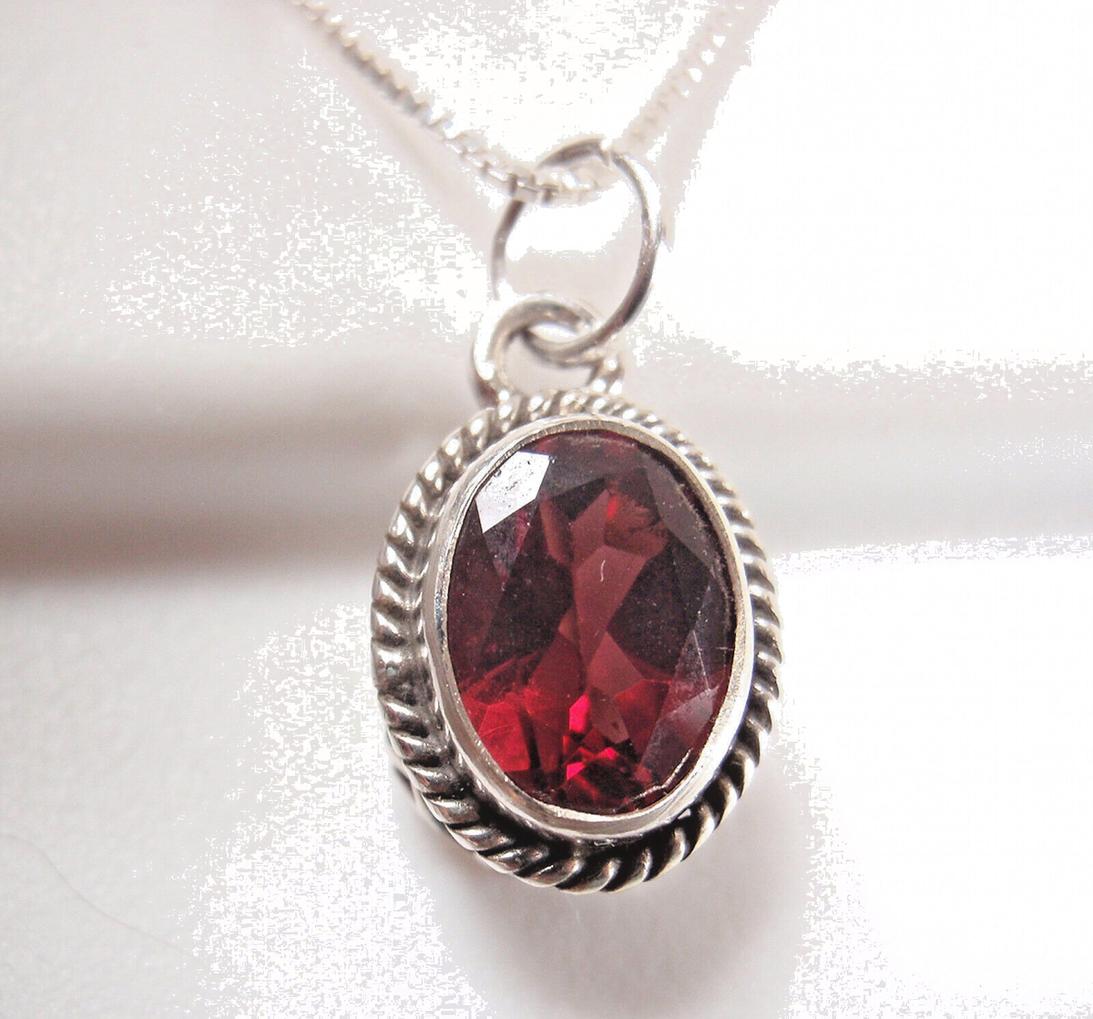 Small Faceted Garnet Oval 925 Sterling Silver Necklace with Swirl