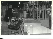 1995 Press Photo Man looks at office chairs for sale at Watervliet Arsenal, NY