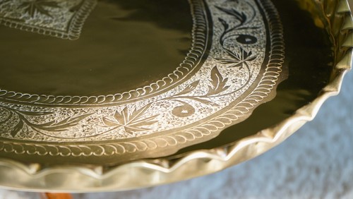 Mid Century Moroccan Engraved Brass Oval Coffee Table on Teak Spider Legs - Picture 9 of 23