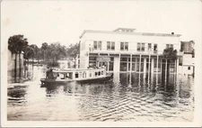 RPPC LaBelle Florida Flooded Street Scene & Boat Labelle Hardware Store c. 1910