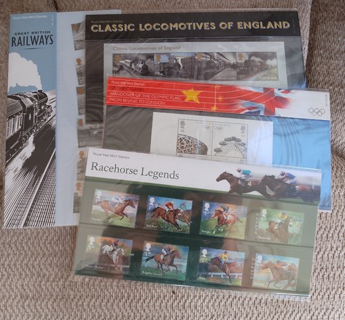Vier Präsentationspakete: Eisenbahnen, Rennpferde, Olympiade - gültiger Briefmarkenwert 28£