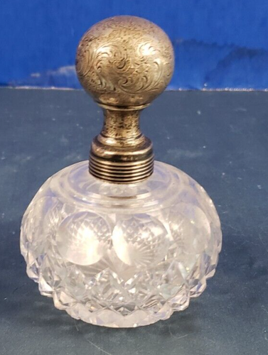 Antique cut glass and silver mounted rim perfume bottle
