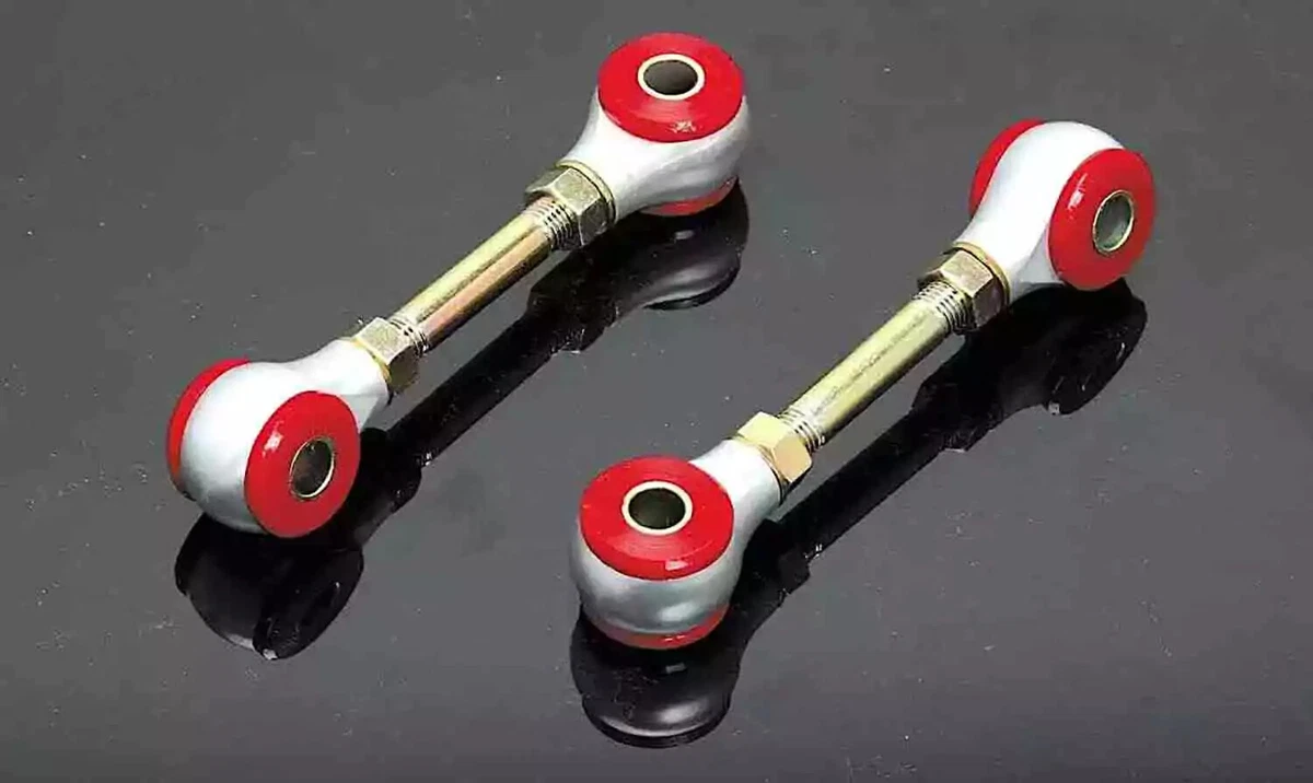 A set of adjustable aftermarket Racing Beat sway bar links for the 1990-2005 Mazda Miata, displayed on a glossy black background.