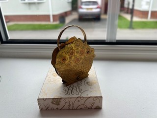 Unknown make Flower basket design powder compact.