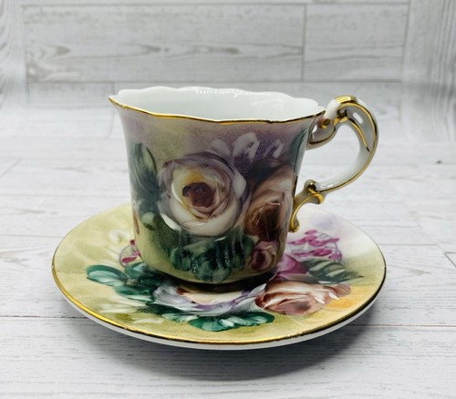 Hand Painted Floral Porcelain Teacup & Saucer with Gilded Edge and Ornate Handle - Picture 4 of 21