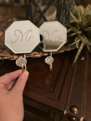 Elegant Mr and Mrs decorative hooks with clear glass knobs.