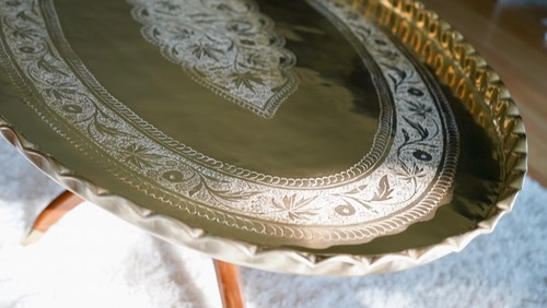 Mid Century Moroccan Engraved Brass Oval Coffee Table on Teak Spider Legs - Picture 10 of 23