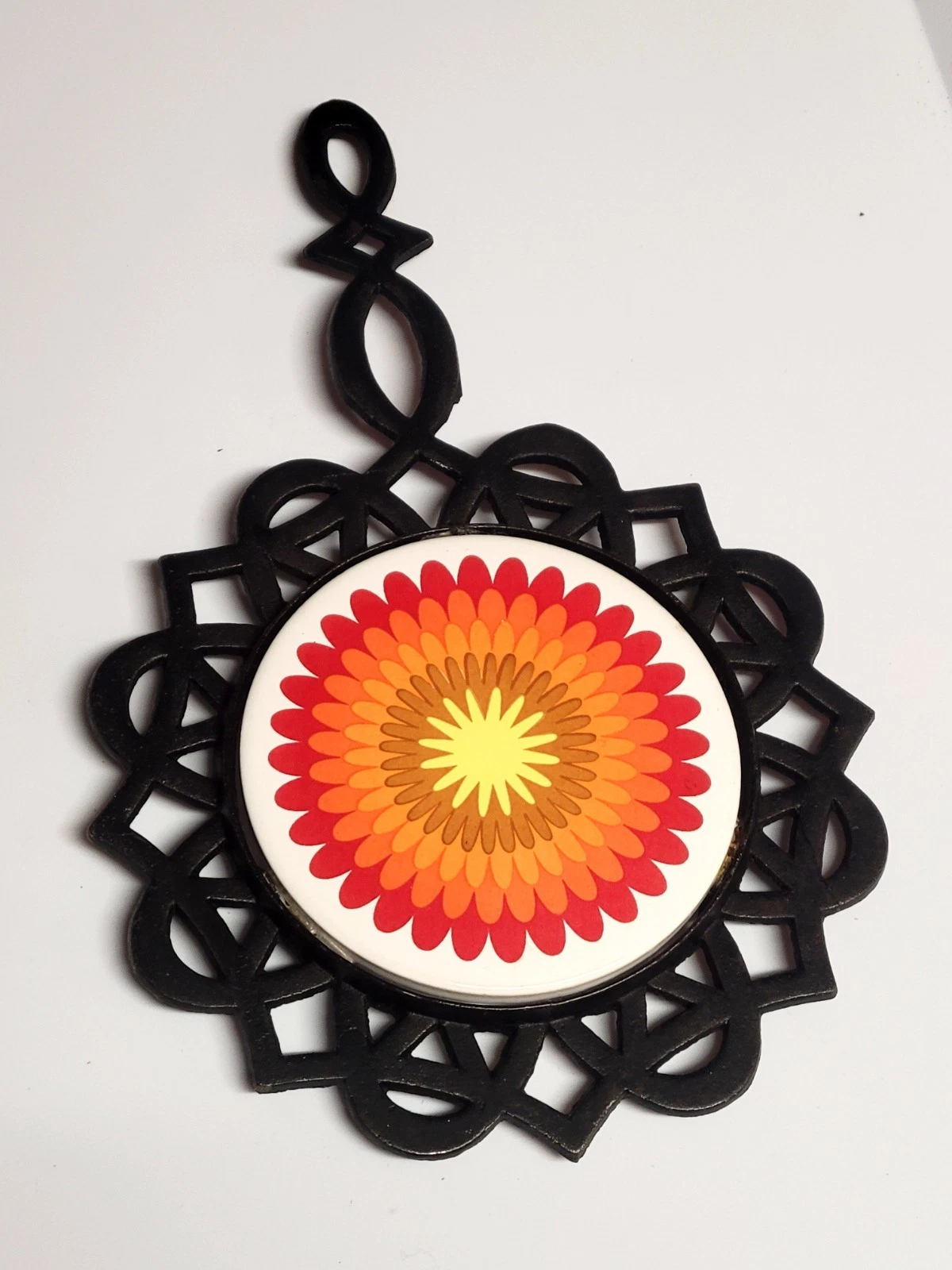 vintage 1970s psychedelic floral cast iron trivet and hot pad - product detail image 1