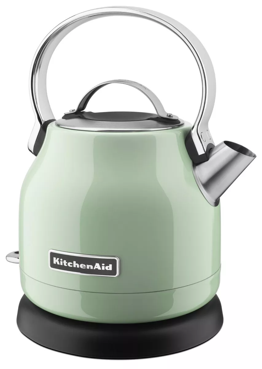 metal kettle on a whirlpool electric stove top boiling water in a