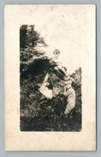Boys Playing in Bushes RPPC Antique Horseplay Snapshot Photo Postcard 1910s