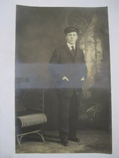 WELL DRESSED MAN BESIDE CHAIR PORTRAIT REAL PHOTO POSTCARD 1910 RPPC