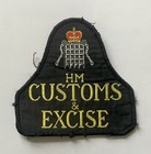 Obsolete British Her Majesty's Customs & Excise bell shaped patch
