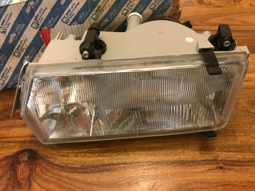 Lancia Dedra RHD NEW GENUINE left hand headlight for wash/wipe 82467729 6TOP - Picture 1 of 12