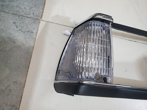 Toyota Corolla KE70, TE70 1982 Front Headlight Bezel & Grill with Parking New - Picture 10 of 15