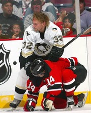 Dick Tarnstrom Pittsburgh Penguins puts the lumber on Brian - Ice Hockey Photo