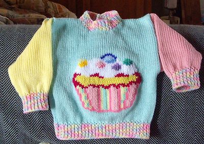 REALLY CUTE ..SIZE 1. NEW HANDKNITTED JUMPER CUP CAKE..