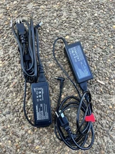 two universal replacement AC adapters 20V and 3.25A (65W).