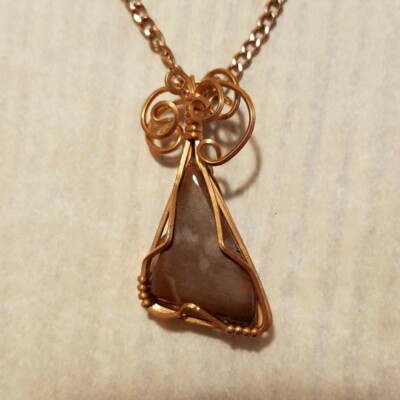 Beautiful wire wrapped Creek stone pendant