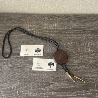 Bolo Tie Gold Tone Medalion  Play it Safe. Black  Rope