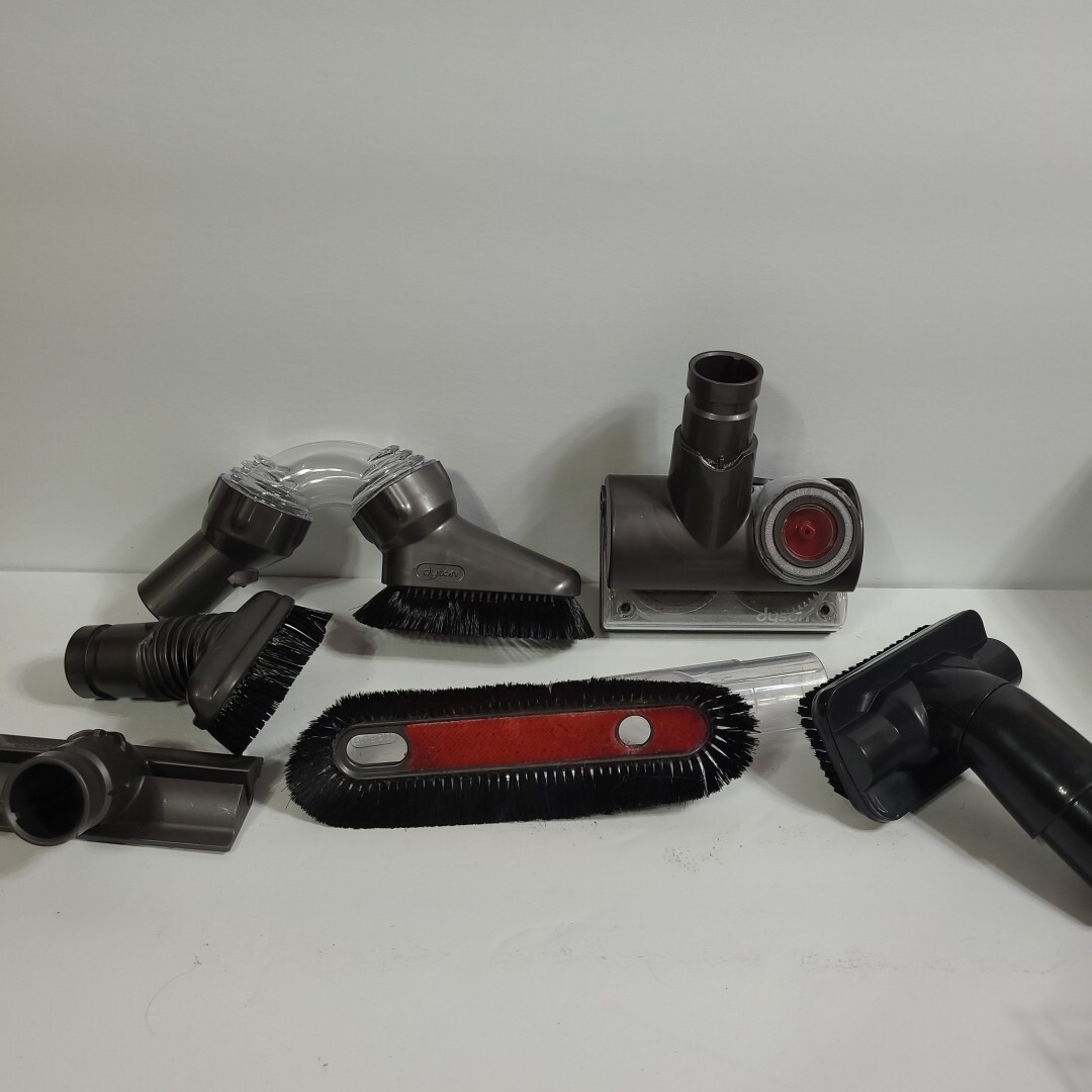 Lot of 6 Dyson vacuum attachments including tangle-free grey brushes and accessories