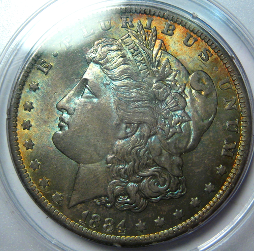 DÓLAR DE PLATA MORGAN TONIFICADO 1884-O ~ PCGS MS64 CAC APROBADO EN SOPORTE DE CASCABEL ANTIGUO* - Imagen 2 de 5