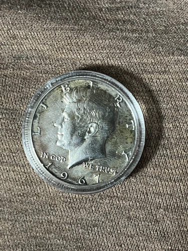 1967 50C Kennedy Half Dollar in capsule as seen in photos