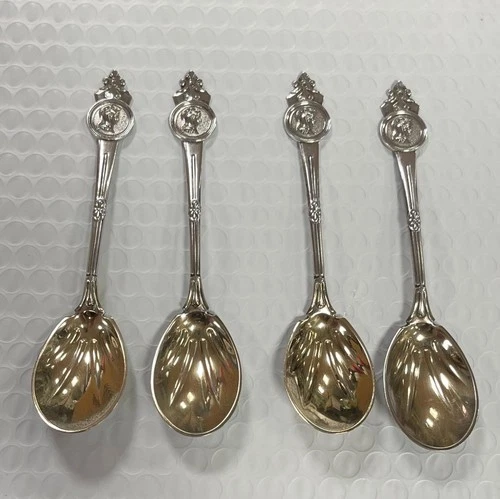 4 TIFFANY & CO. STERLING SILVER GORHAM MEDALLION 6" SPOONS.