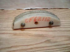 Seven White Half-Moon Hard Plastic Spacers.