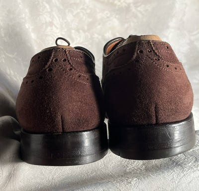 Alden 904 Wing Tip Bal is built on the Hampton last. The model has a mocha Suede leather upper with a single leather outsole.