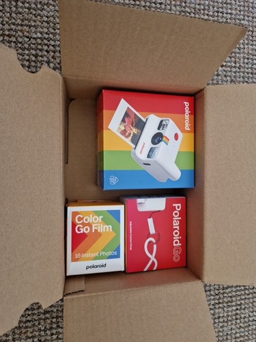 Polaroid Go Generation 2 Instant Camera with adjustable camera strap, photo pack