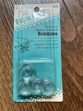 TRAUM NEW PKG VINTAGE TRANSPARENT PLASTIC SEWING BOBBINS no. 6127