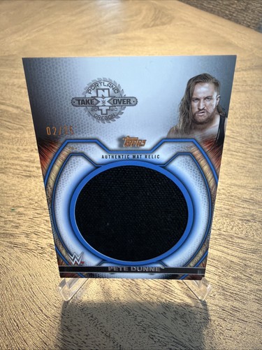 2021 Topps WWE Undisputed - Superstar Mat Relics Pete Dunne #M-PD Blue /25 (MEM) - Picture 1 of 3