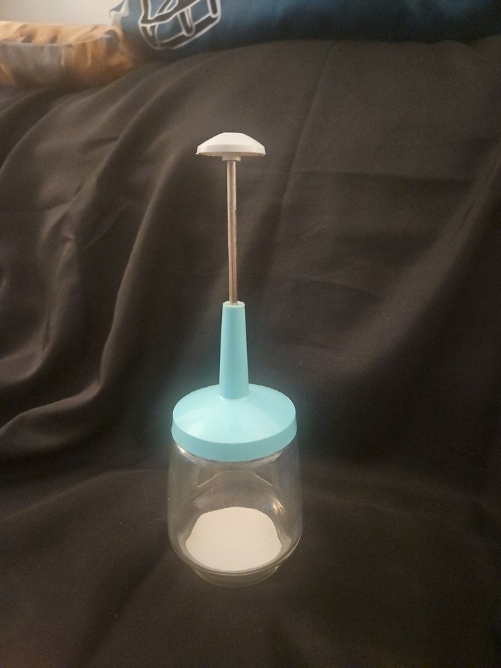 A made-in-USA aqua-colored mid-century nut & herb chopper that looks straight out of a 1960s Betty Crocker photo shoot — that color alone is a 10.