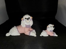 Set Of 2 White Poodles Laying Down With Pink Sweater Figurines