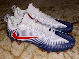 navy blue and white football cleats