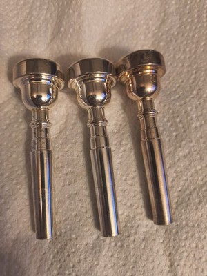 3 Trumpet Mouthpieces 3C 5C And 7c The 5c Is Got A Gold Color To It