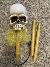 Gemmy Shaking Tribal Shrunken Head Jungle Skull on Bamboo Pole